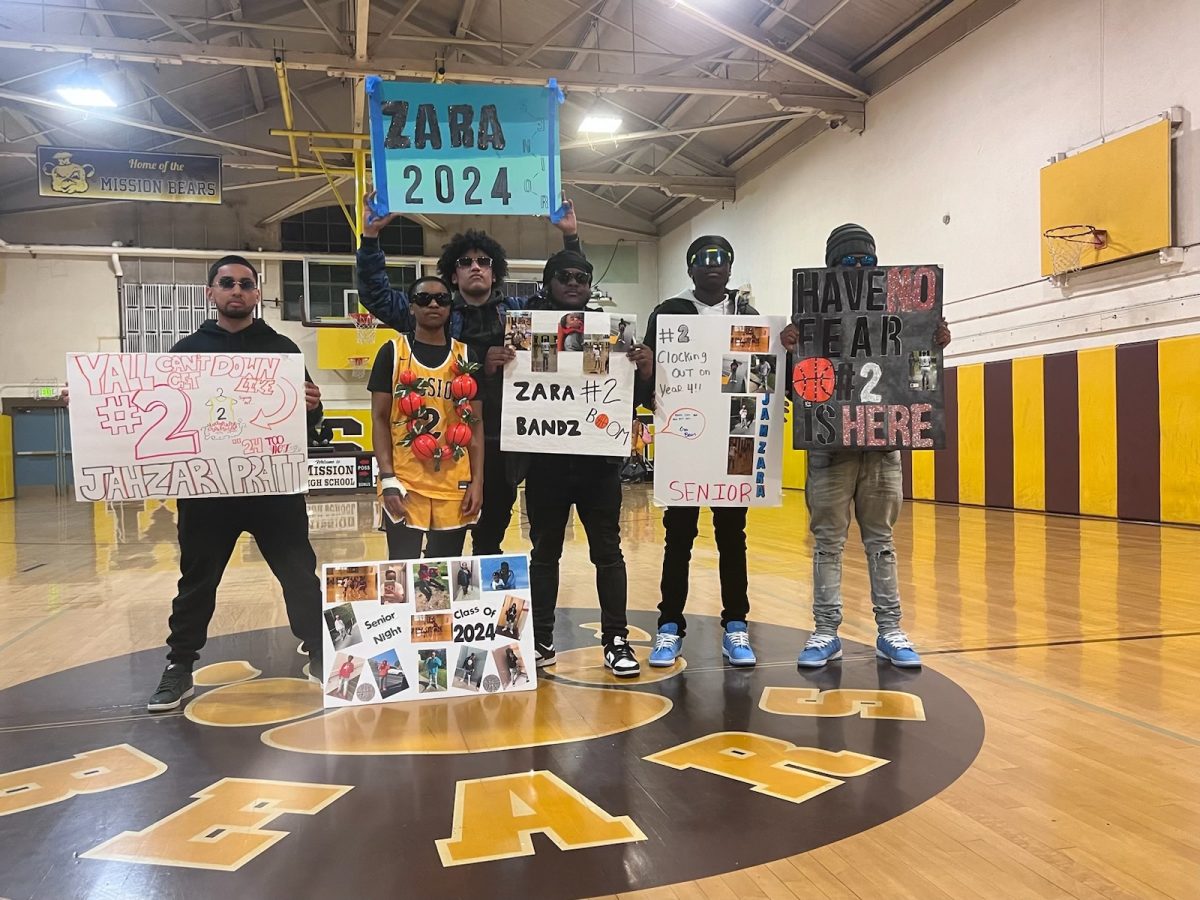Zara, with her brothers and me on Senior Night.