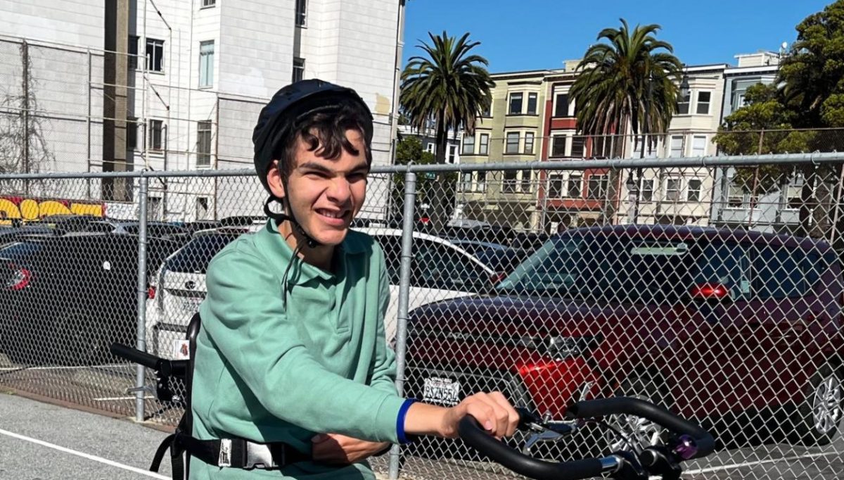 Emilio riding his bike