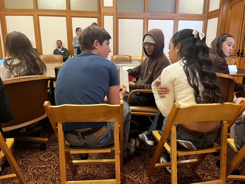 Student Journalists discussing what to ask the interviewee's 