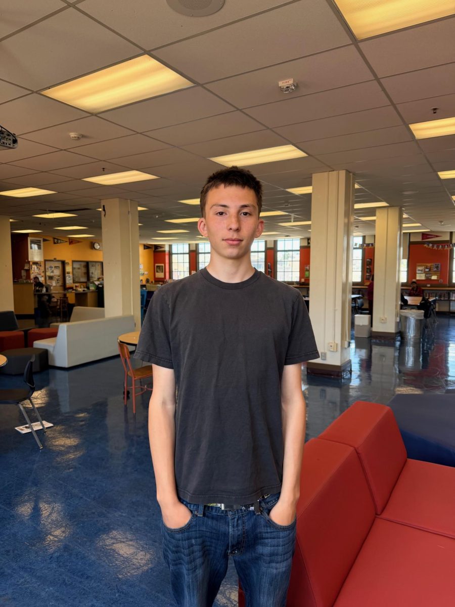 Lucas Araya in the library at Mission. 

