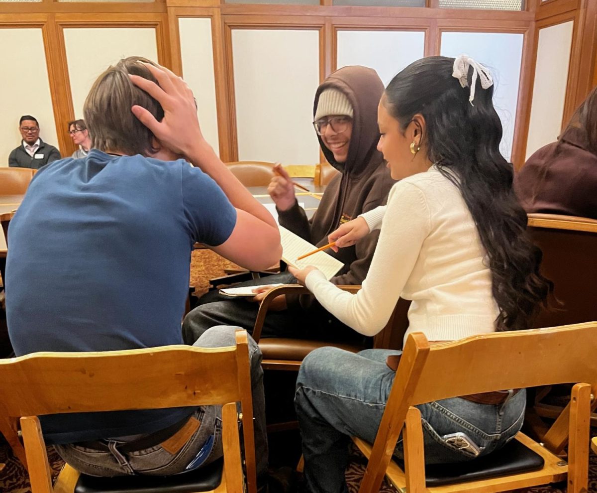 Student Journalists deliberating what question to ask the interviewees